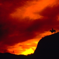 Cowboy On the High Range at Sunset